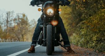 A motorcycle on the side of the road. (Photo: Mike Montgomery / Unsplash)