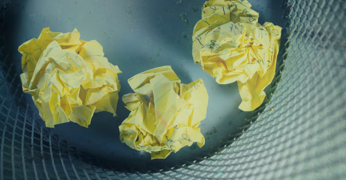Balls of yellow paper in a trash bin. (Photo: Steve A Johnson / Unsplash)