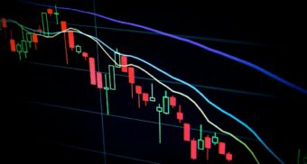 A stock's performance on a laptop. (Photo: Maxim Hopman / Unsplash)