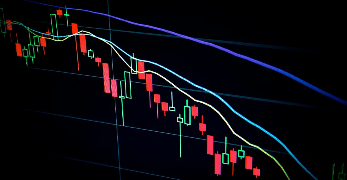 A stock's performance on a laptop. (Photo: Maxim Hopman / Unsplash)