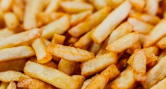 A photo of french fries spread out on a table. (Photo: Durenne Loris / Unsplash)