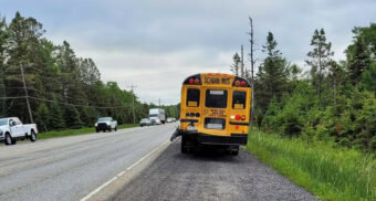 A school bus was rear-ended by a tractor-trailer on Highway 17 near Spanish, Ont. on June 17, 2026. (Photo: Skilled Truckers Canada / Facebook)