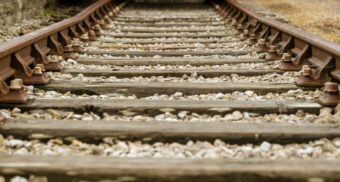 A close-up of train tracks. (Photo: Nick Fewings / Unsplash)