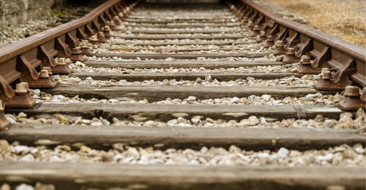 A close-up of train tracks. (Photo: Nick Fewings / Unsplash)